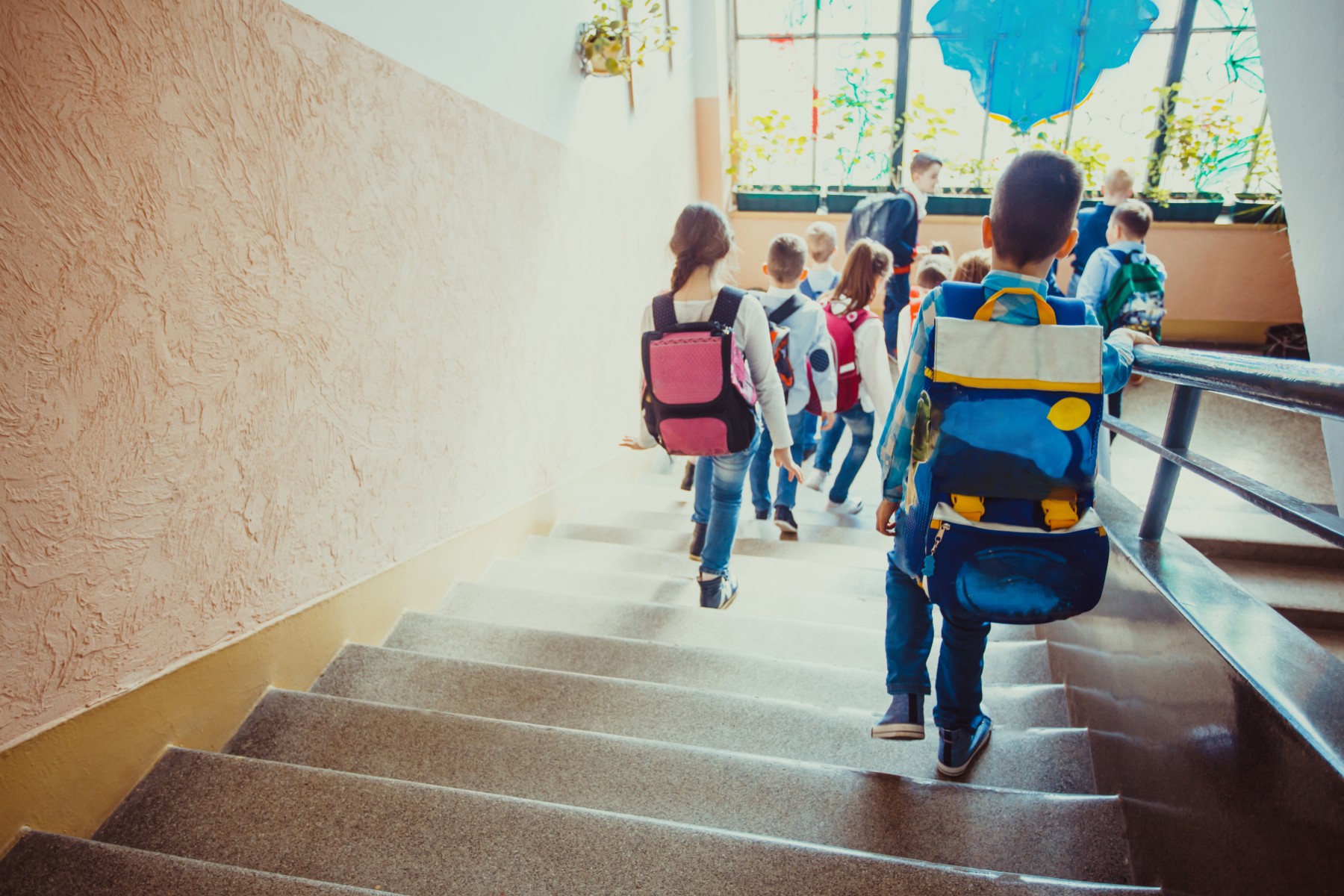 elementary school kids going down the stairs at school | Pass Alliance for Safer Schools