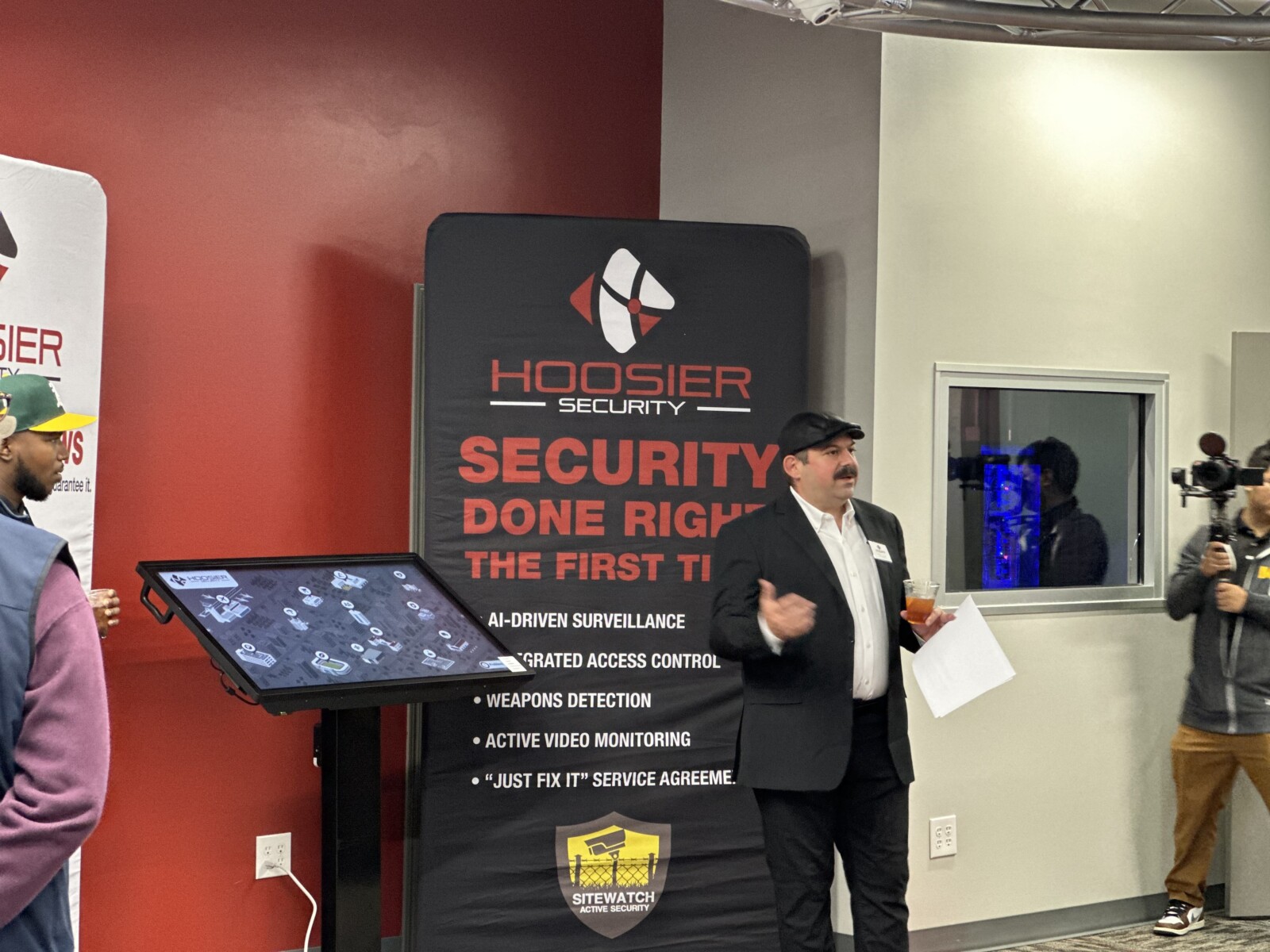 Local security provider | Picture of Hoosier Security President, Armando Perez, speaking in Hoosier Security's new Experience Center during their grand opening celebration.